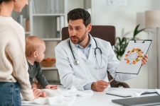 Provider with mother and baby. Lead Poisoning Prevention for Health Care Providers