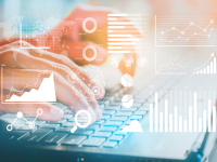 A person typing on a keyboard with images of charts and graphs. A person typing on a keyboard with images of charts and graphs.
